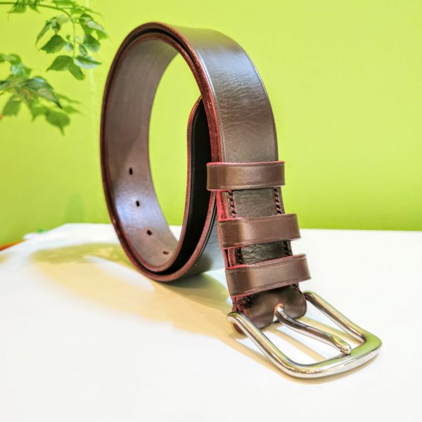 Belt - Essential Distressed Classic in Australian Nut S2 Veg Tan Leather with Red Edge and Stitch on 112 Stainless Steel West End Buckle - standing to right